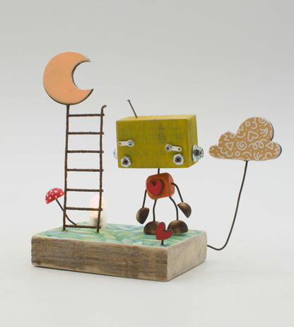 Diorama scultura luminosa stile robot fatto a mano con testa gialla torsino arancione a forma di cuore e base rustica