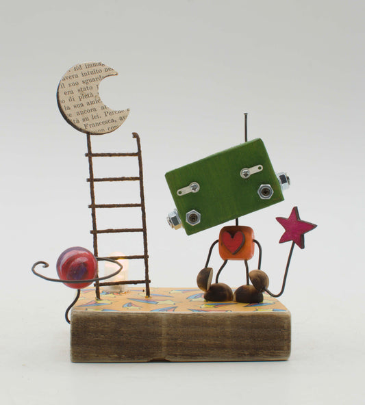 Diorama scultura luminosa stile robot fatto a mano verde con torso arancione a cuore rosso e arti in filo che tiene una stella rosa