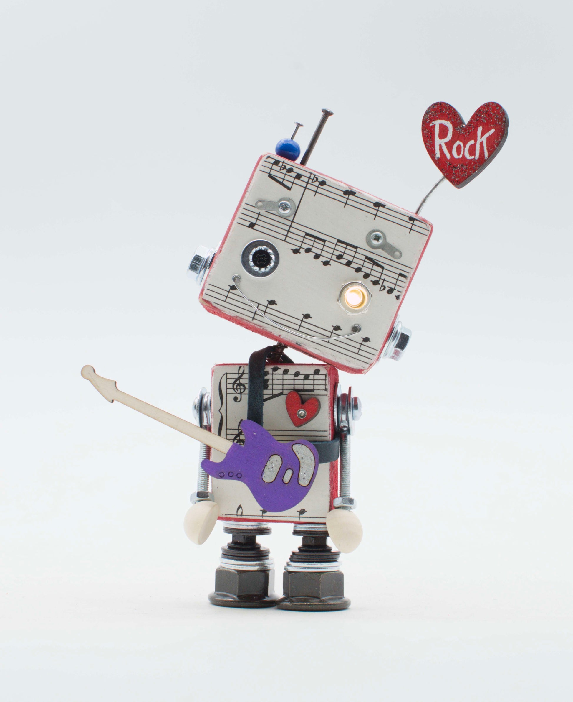 Robot giocattolo in stile retrò con corpo a tema spartiti musicali e chitarra viola lampada di legno a batteria