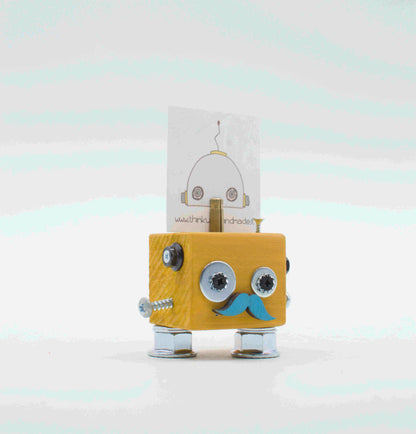 Portafoto da tavolo robot in legno giallo con occhi a vite argento e basette blu in carta, gambe metalliche handcrafted